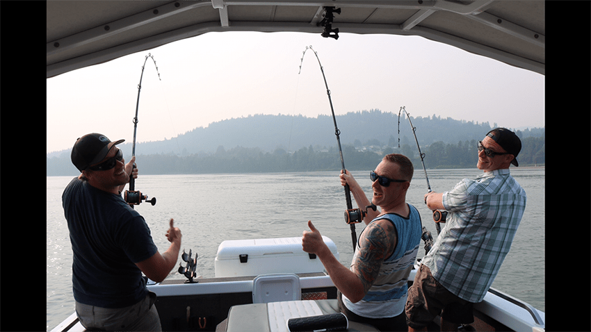 Angler holding a salmon caught on the Fraser River